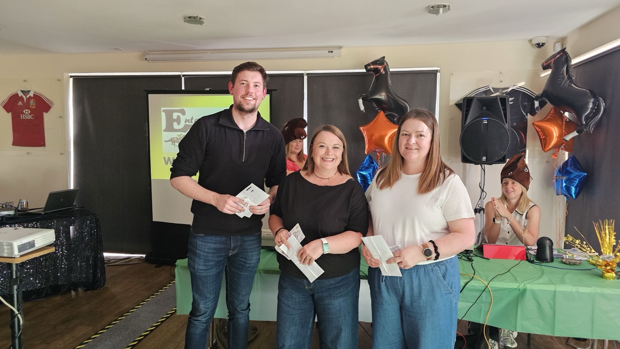 Image of team members from Drummond Laurie Chartered Accountants celebrating 13 years in business at the horse racing themed party.