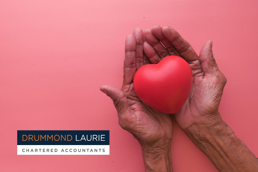 What community means to Drummond Laurie. Image of a pair of hands cradling a symbolic love heart.
